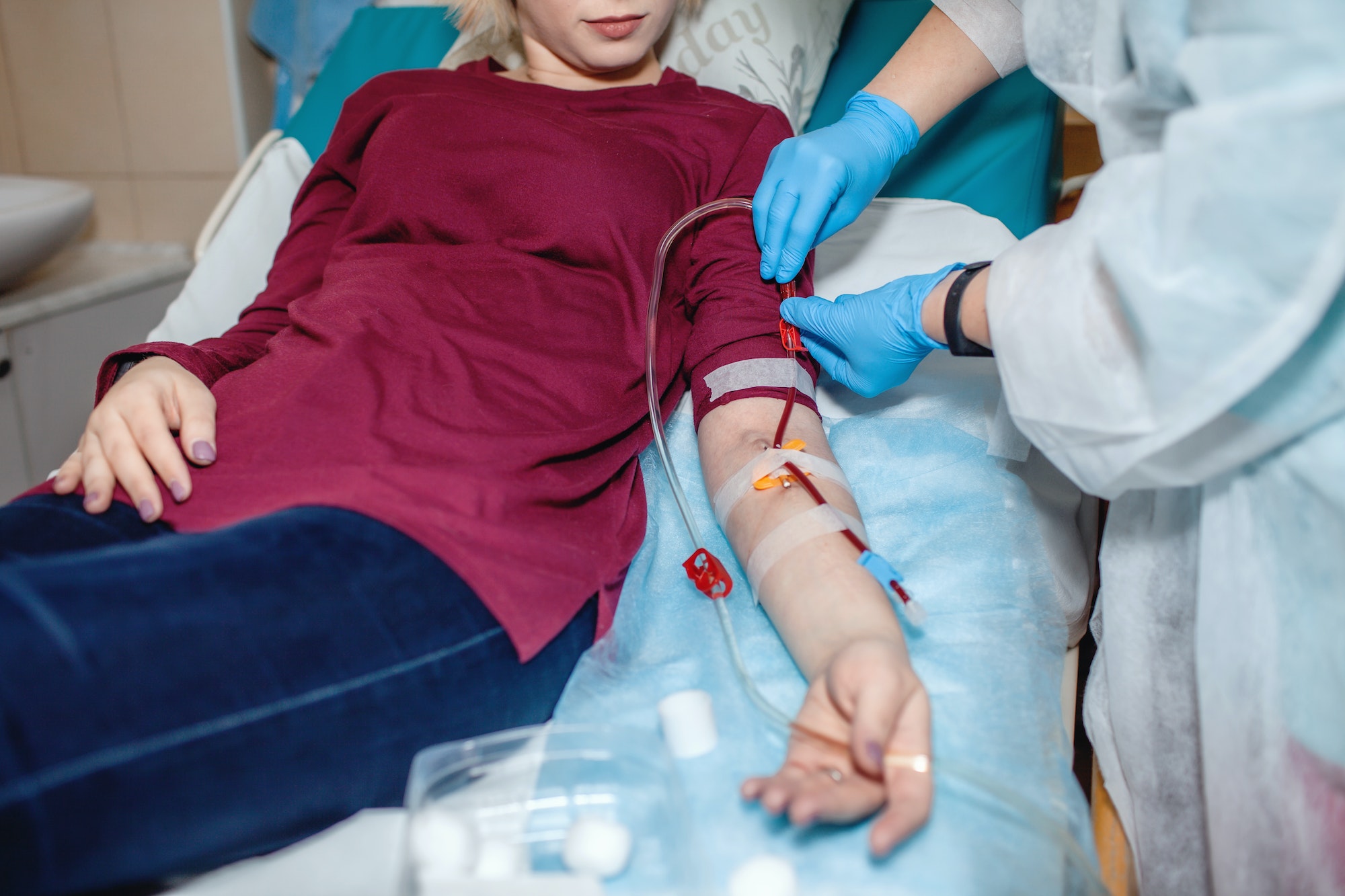 Young girl on hemodialysis in hospital, dialysis system equipment, kidney disease chronic patient